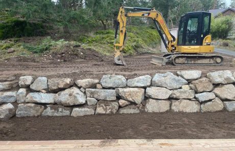 excavating backyard retaining wall